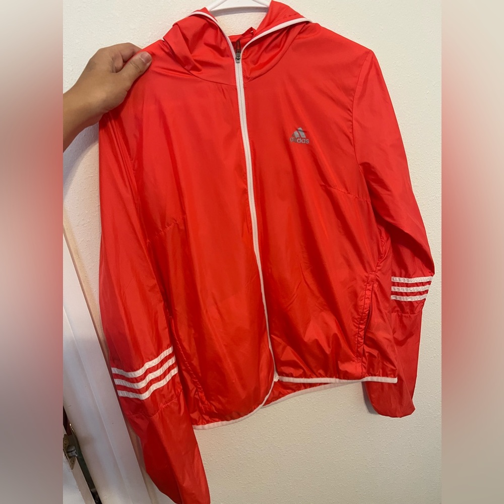 Pink wind breaker. Good condition.